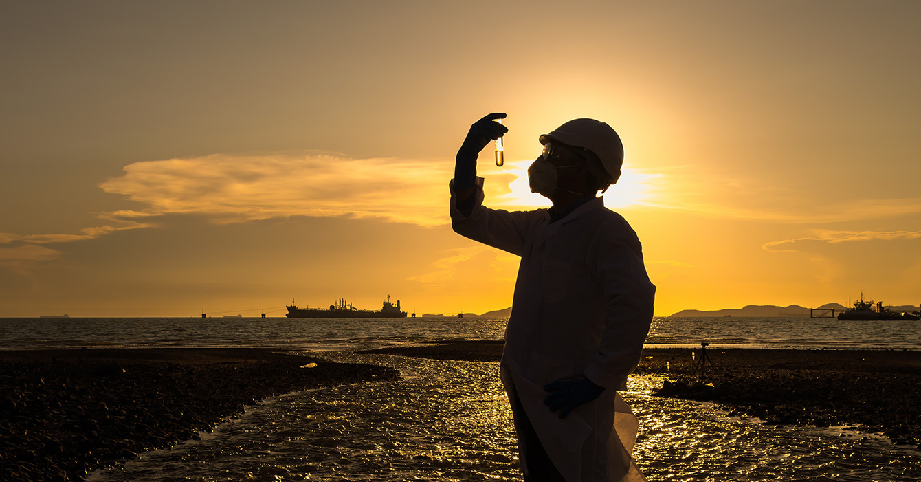 A worker using a HSEQ software system to report on environmental, health and safety measures