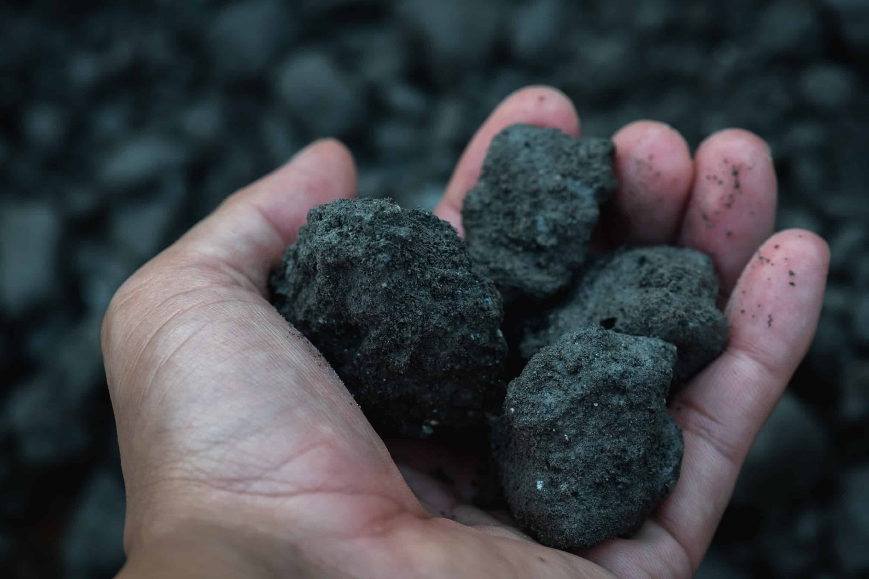 Coal,Miner,In,The,Man,Hands,Of,Coal,Background.,Industrial
